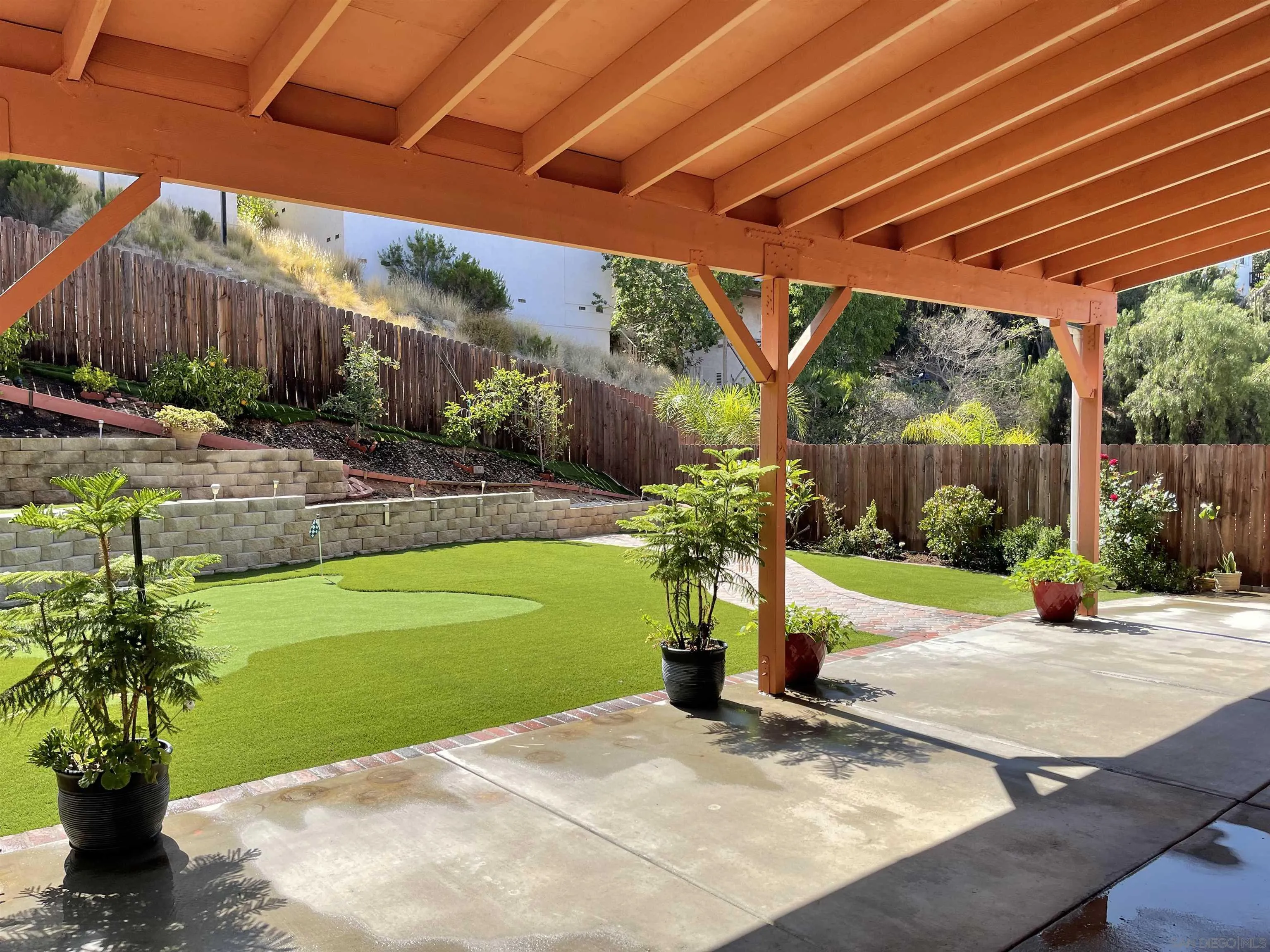 1637 Paraiso Avenue Spring Valley, CA 91977 - Photo 7 of 45 a view of a patio with table and chairs potted plants