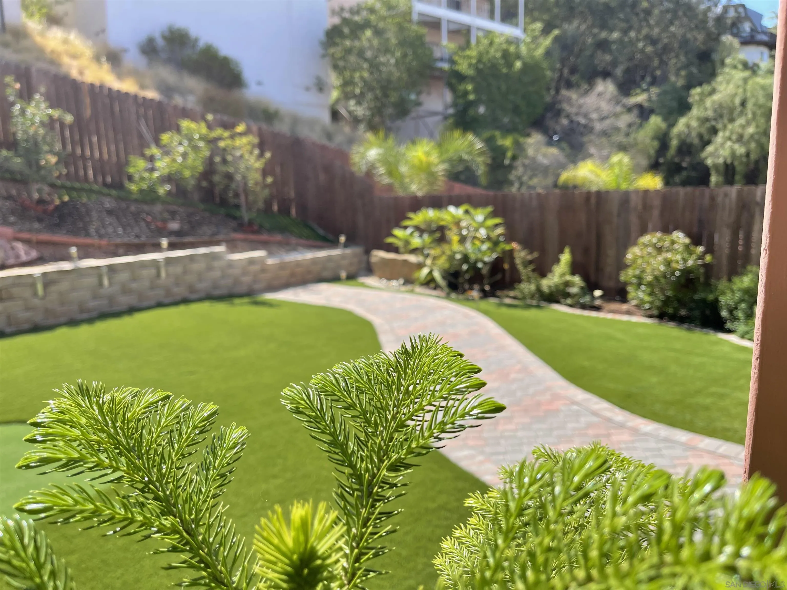 1637 Paraiso Avenue Spring Valley, CA 91977 - Photo 8 of 45 a view of a garden with a fountain
