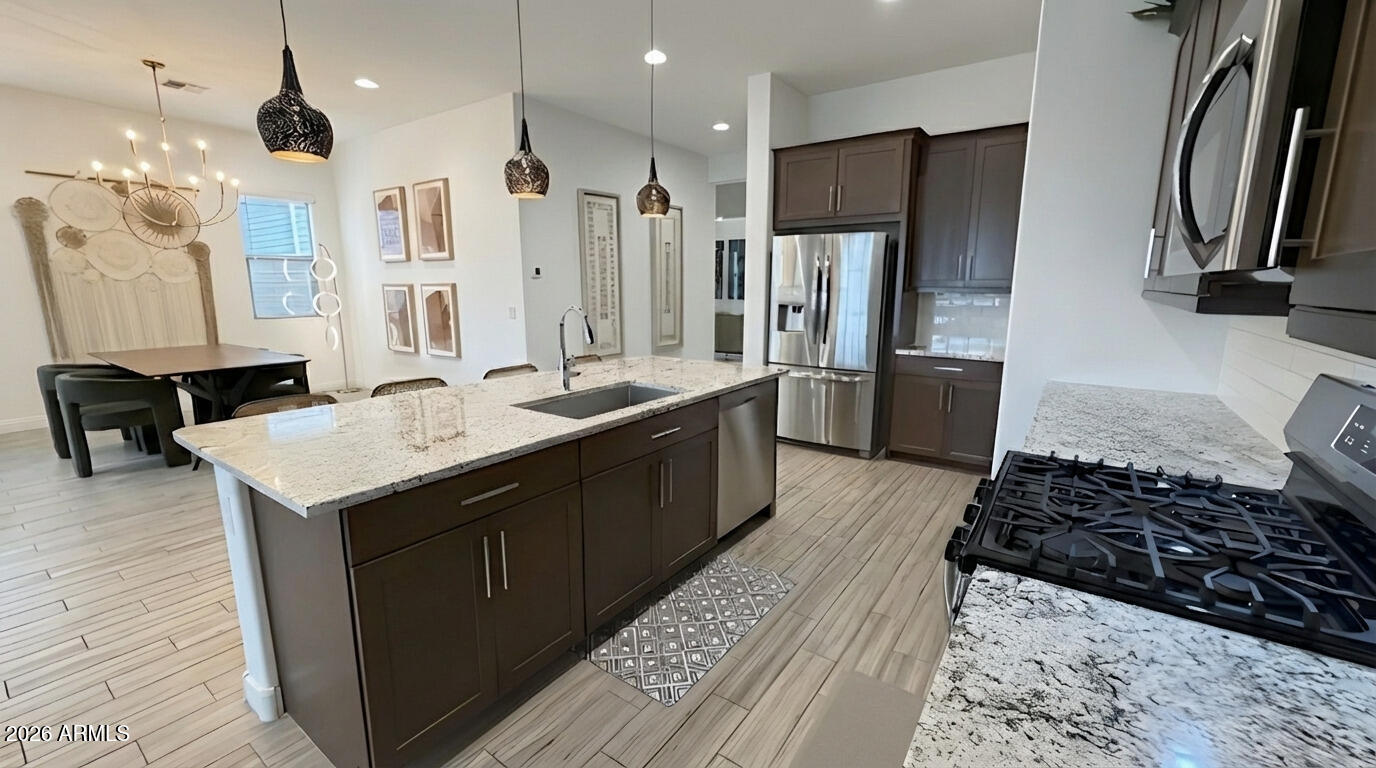 19615 West Cheery Lynn Road Buckeye, AZ 85396 - Photo 9 of 32 Kitchen into Dining Room