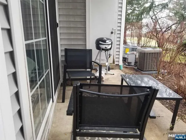 a kitchen with a sink and a stove next to a large window