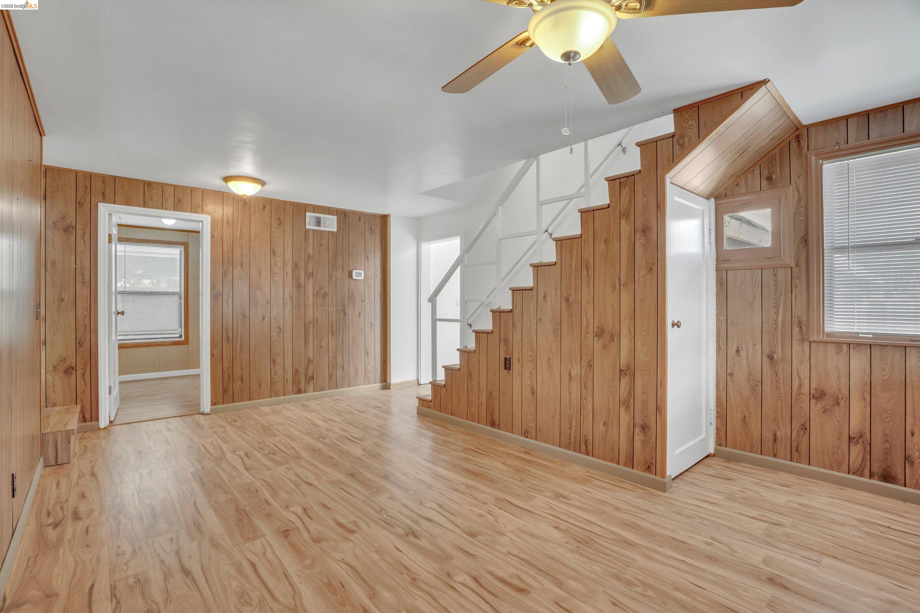 1922 Taylor Road Bethel Island, CA 94511 - Photo 12 of 49 Unfurnished living room with wooden walls, ceiling fan, and light wood finished floors