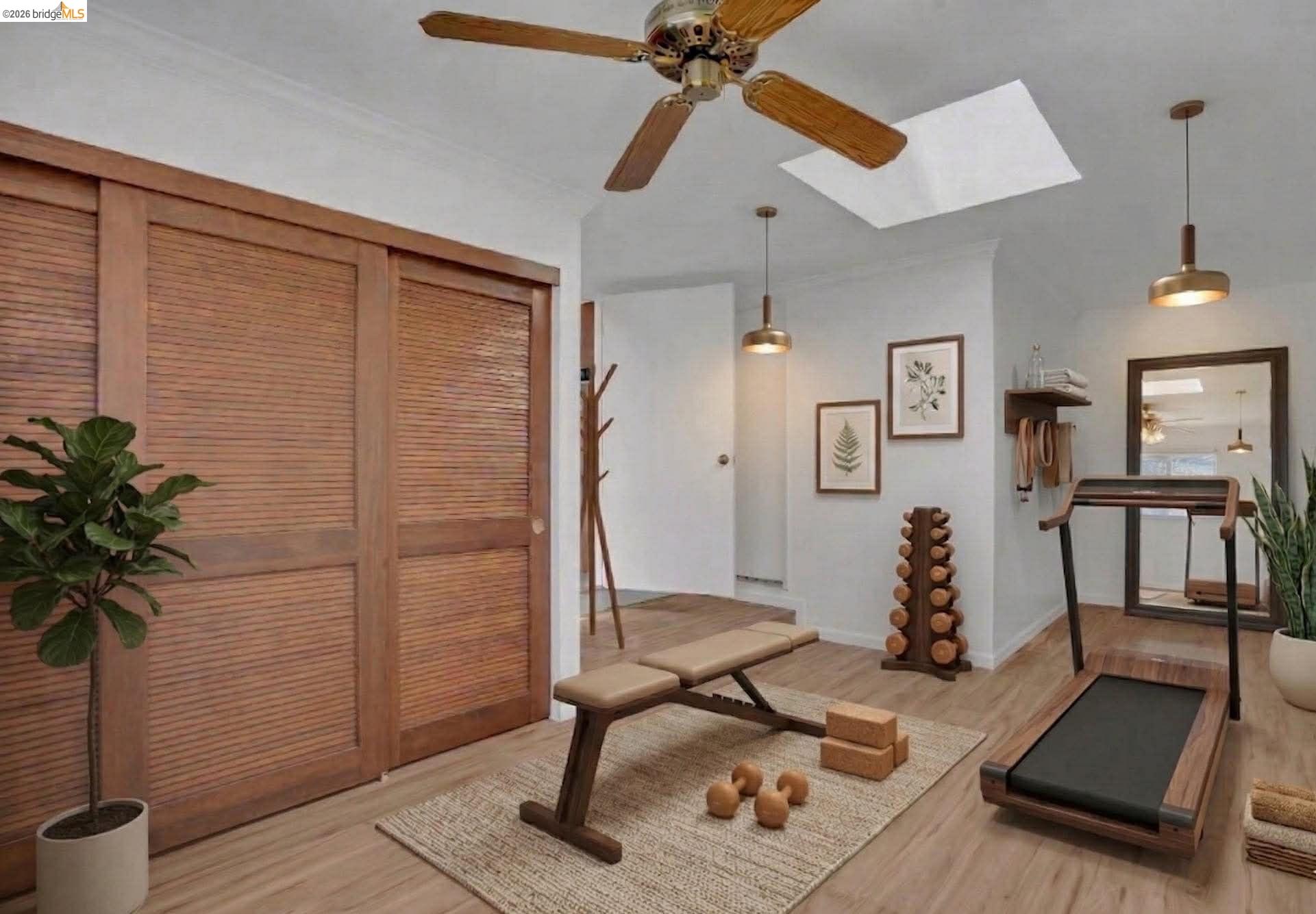 1922 Taylor Road Bethel Island, CA 94511 - Photo 20 of 49 Exercise area featuring ceiling fan, a skylight, and light wood-style flooring