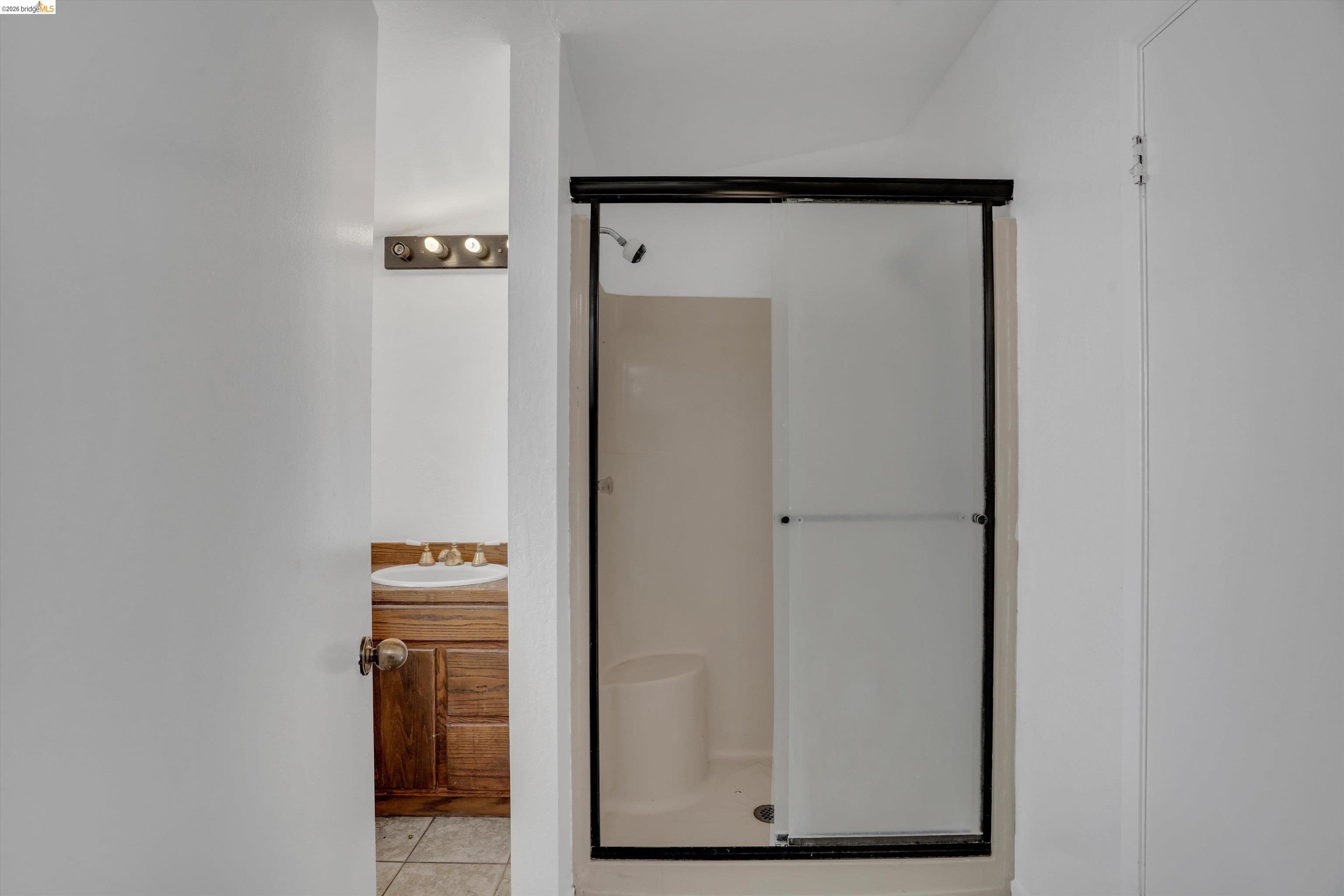 1922 Taylor Road Bethel Island, CA 94511 - Photo 22 of 49 Bathroom featuring vanity, a stall shower, and light tile patterned floors