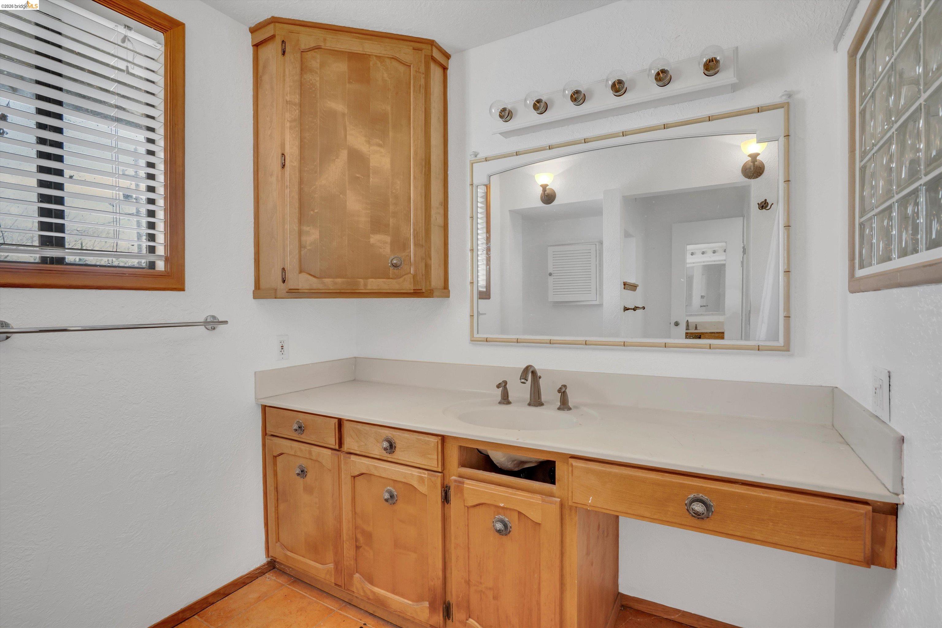 1922 Taylor Road Bethel Island, CA 94511 - Photo 24 of 49 Bathroom featuring vanity and light tile patterned floors