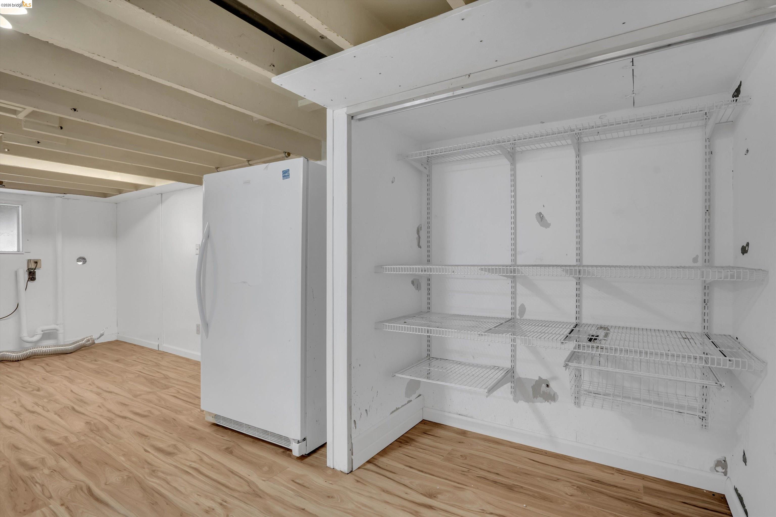 1922 Taylor Road Bethel Island, CA 94511 - Photo 31 of 49 Detailed view of wood finished floors and freestanding refrigerator