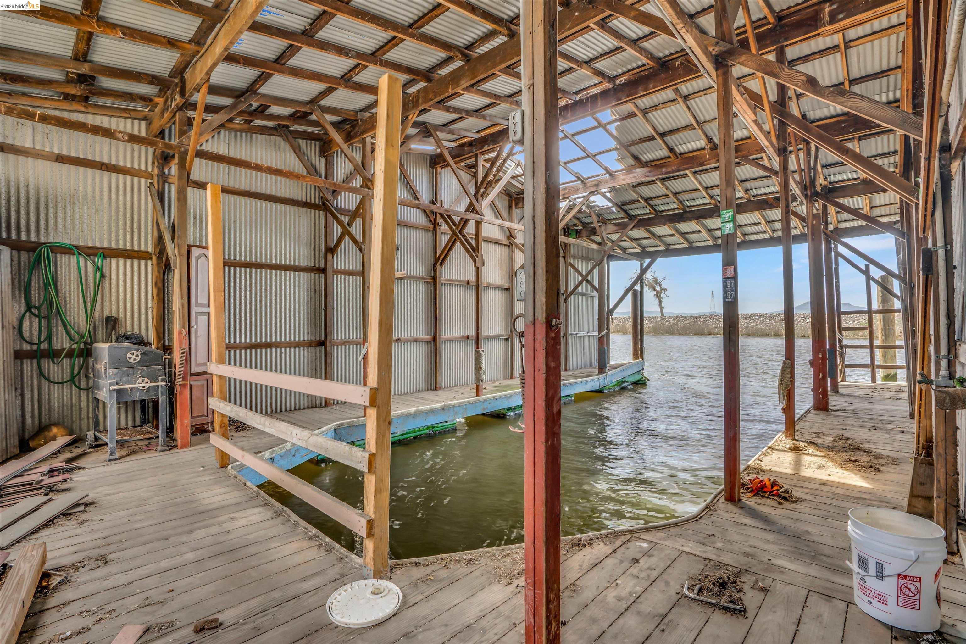 1922 Taylor Road Bethel Island, CA 94511 - Photo 39 of 49 Misc room featuring lofted ceiling, a water view, and wood-type flooring