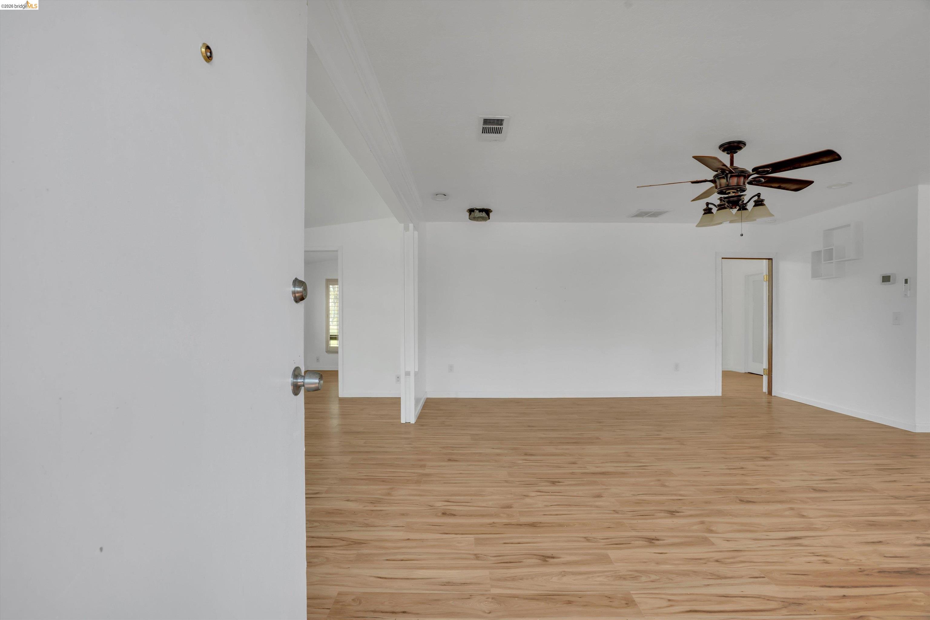 1922 Taylor Road Bethel Island, CA 94511 - Photo 6 of 49 Empty room featuring light wood-style floors and a ceiling fan