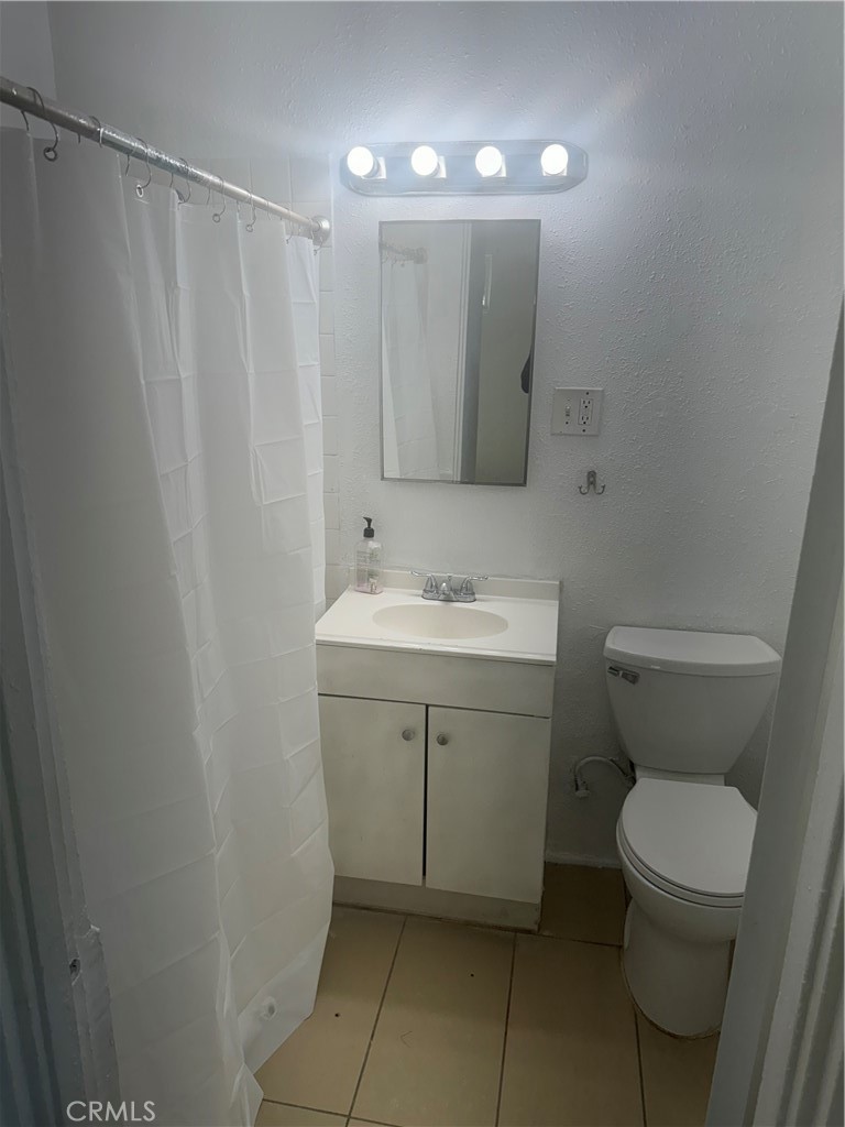 41209 Sunset Lane Hemet, CA 92544 - Photo 5 of 5 a bathroom with a sink a toilet and shower