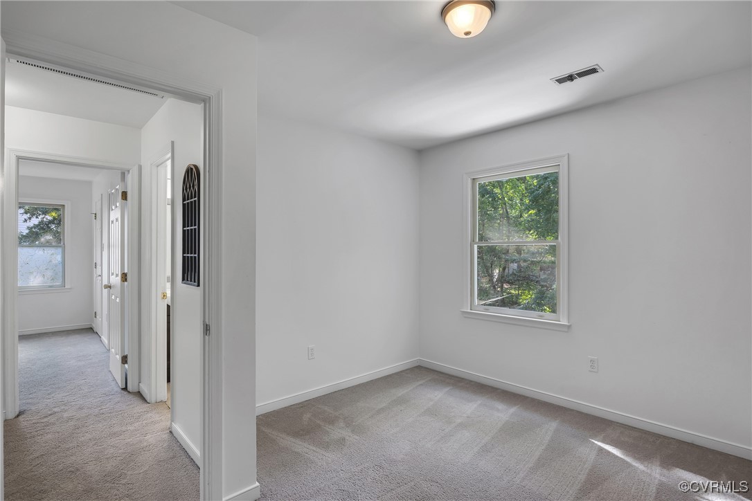 10718 Timberun Road Chesterfield, VA 23832 - Photo 29 of 45 an empty room that has a window and a mirror