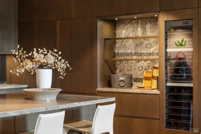 a view of kitchen with granite countertop cabinets and a potted plant