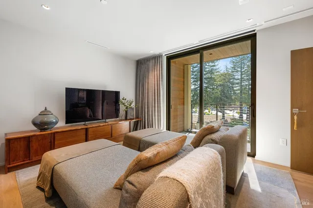 a bedroom with furniture and a potted plant