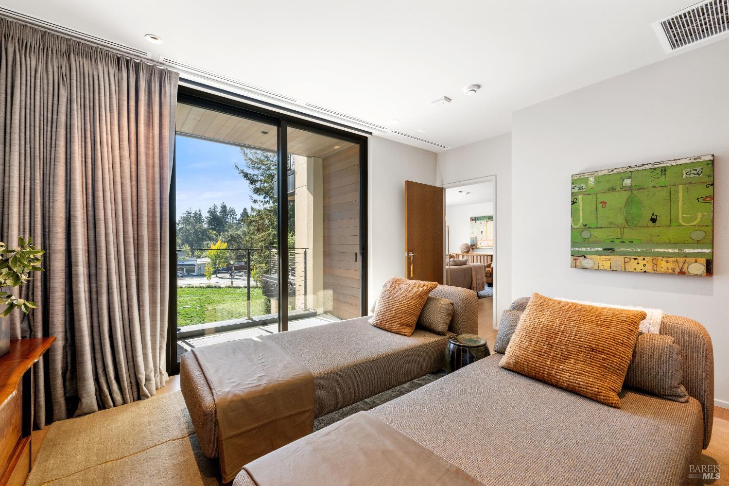 171 Sawmill Circle, Unit 304 Healdsburg, CA 95448 - Photo 22 of 28 a bedroom with two beds and a large window