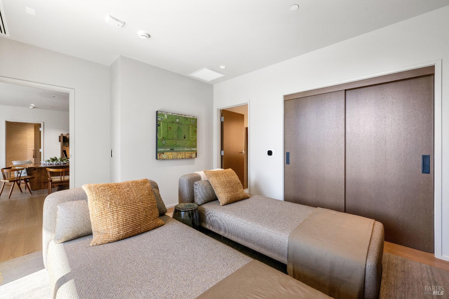 171 Sawmill Circle, Unit 304 Healdsburg, CA 95448 - Photo 23 of 28 a bedroom with furniture and a potted plant