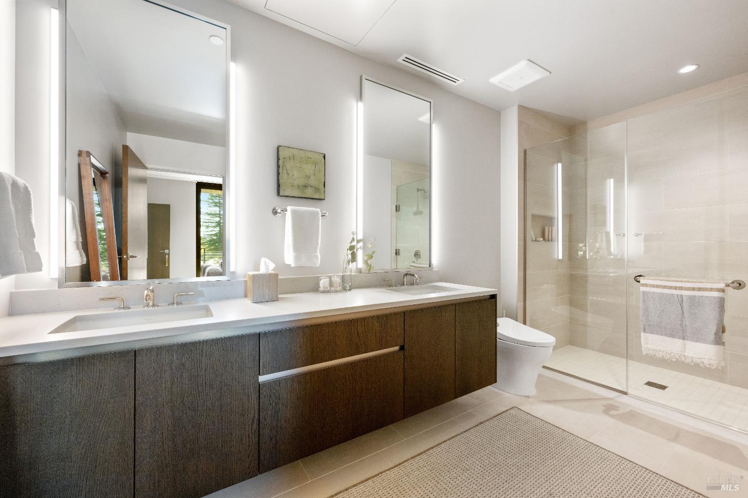 171 Sawmill Circle, Unit 304 Healdsburg, CA 95448 - Photo 24 of 28 a bathroom with a double vanity sink toilet and shower