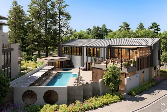 an aerial view of a house with garden space and sitting area