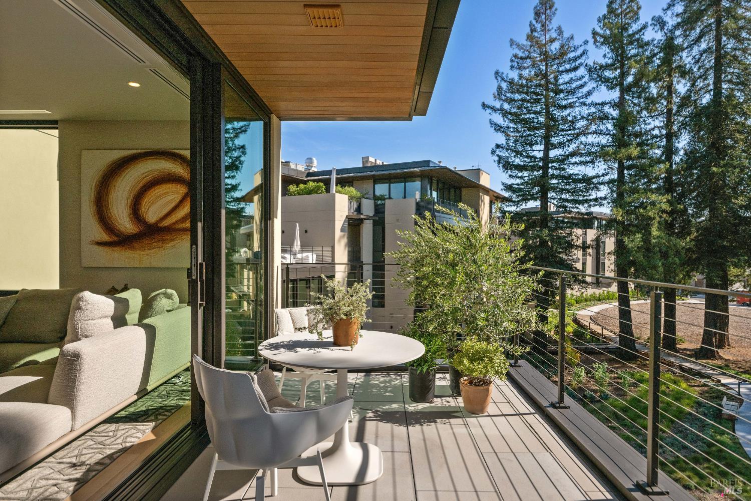 171 Sawmill Circle, Unit 304 Healdsburg, CA 95448 - Photo 4 of 28 a view of a balcony dining table and chairs