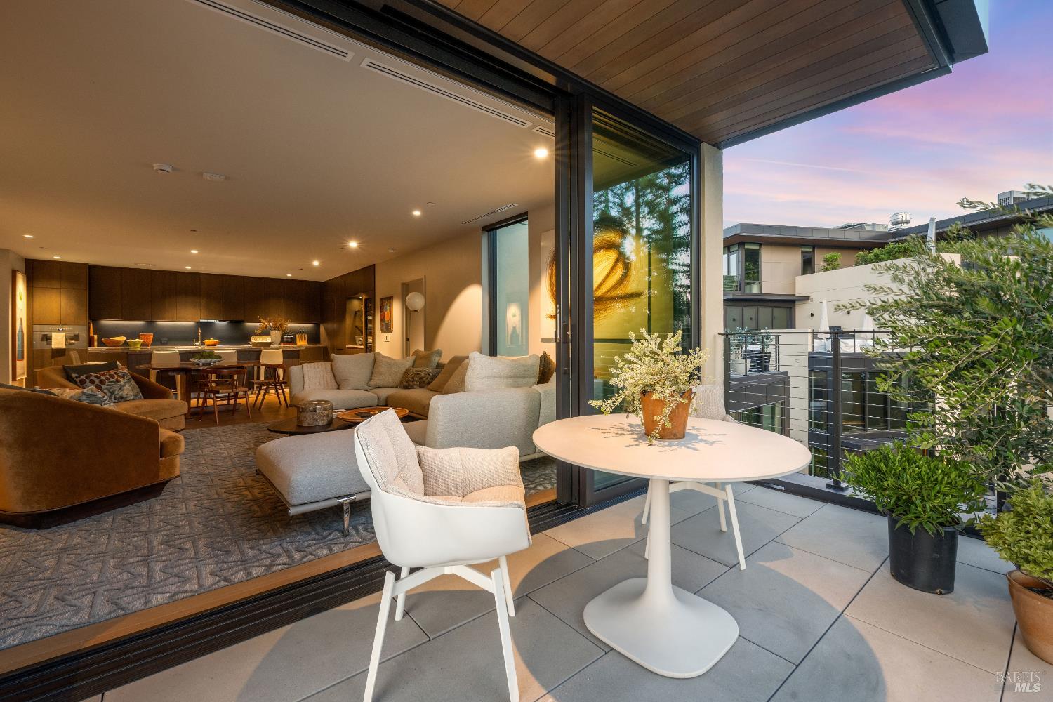 171 Sawmill Circle, Unit 304 Healdsburg, CA 95448 - Photo 5 of 28 a dining room with furniture and a potted plant