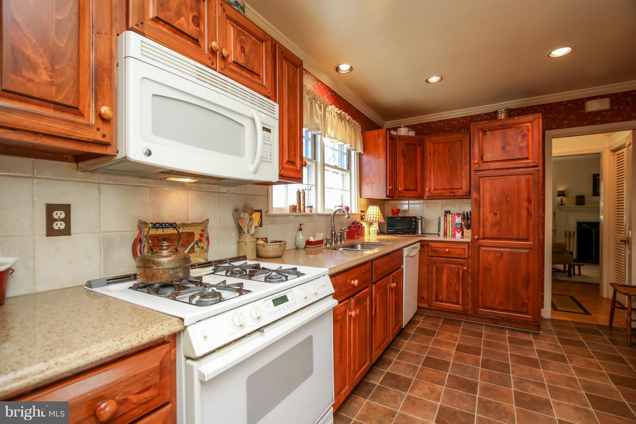 503 Worcester Road Towson, MD 21286 - Photo 8 of 18 a kitchen with a stove a sink and a refrigerator