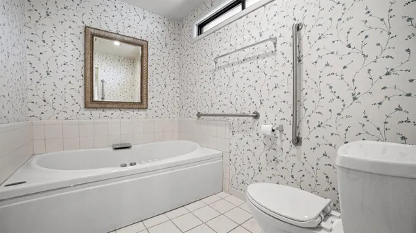a bathroom with a toilet and a sink