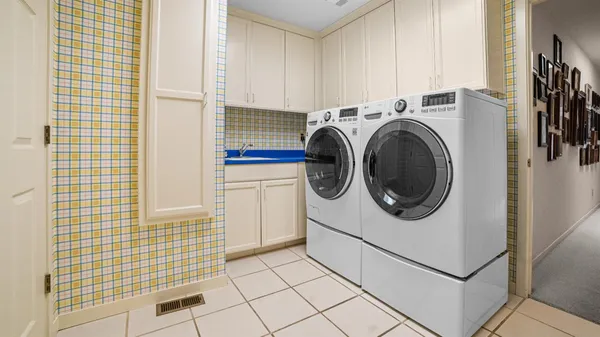 a utility room with dryer and washer