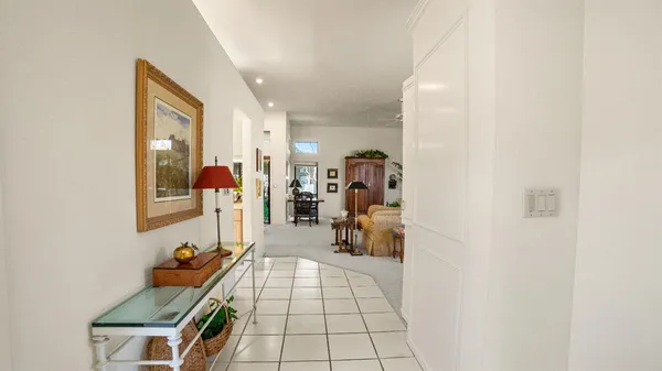 a room with furniture and a mirror