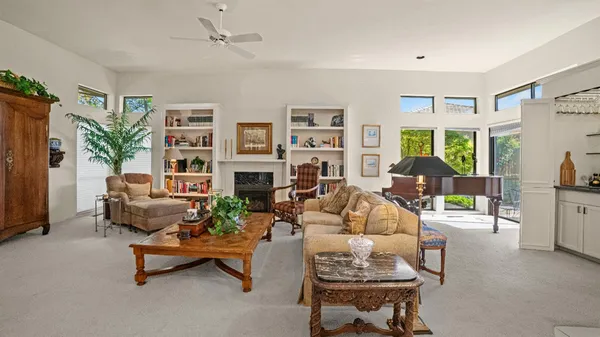 a living room with furniture and a fireplace