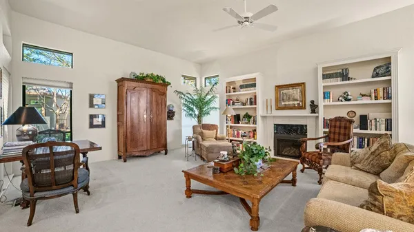 a living room with furniture and a fireplace