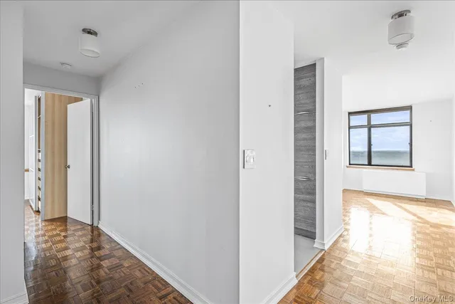 a view of a hallway with washer and dryer