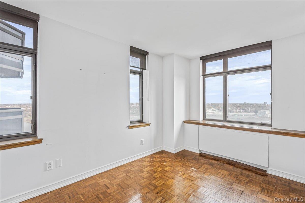 112-01 Queens Boulevard, Unit 23C Queens, NY 11375 - Photo 19 of 32 an empty room with windows