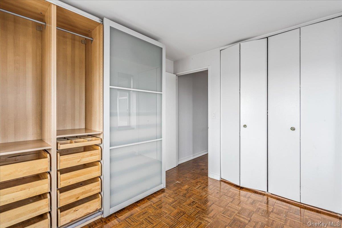 112-01 Queens Boulevard, Unit 23C Queens, NY 11375 - Photo 20 of 32 a view of closet area with empty racks