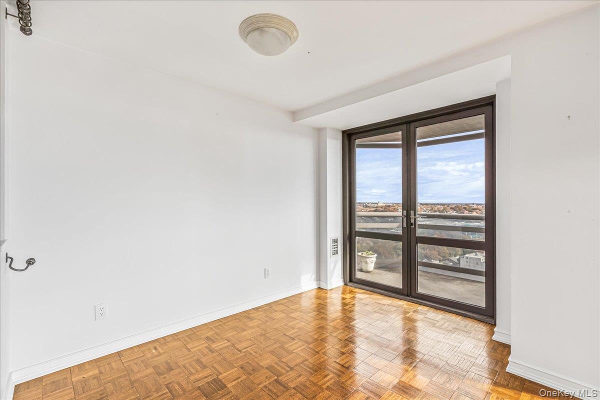 112-01 Queens Boulevard, Unit 23C Queens, NY 11375 - Photo 10 of 32 a view of an empty room and window