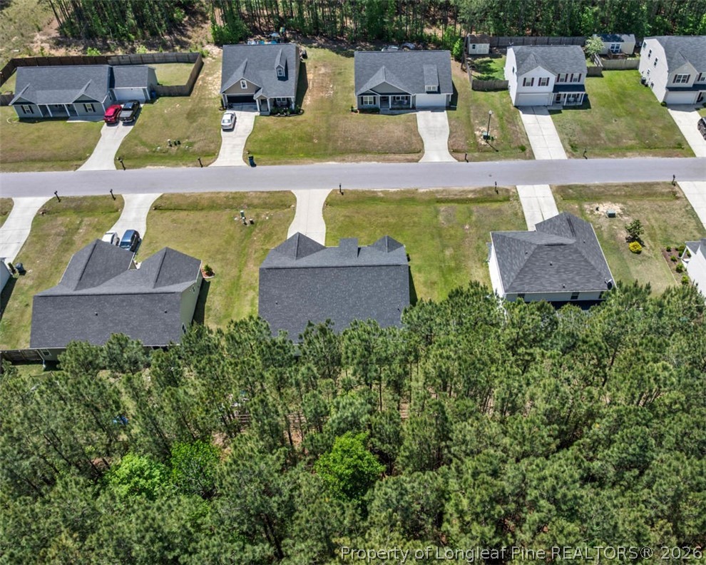 83 Kotata Avenue Bunnlevel, NC 28323 - Photo 12 of 49 an aerial view of a house with garden space and a patio
