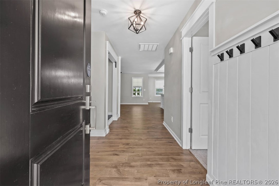 83 Kotata Avenue Bunnlevel, NC 28323 - Photo 16 of 49 a view of a hallway with wooden floor