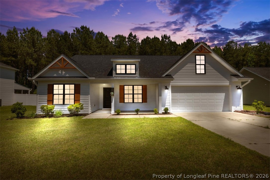 83 Kotata Avenue Bunnlevel, NC 28323 - Photo 2 of 49 a front view of a house with a yard