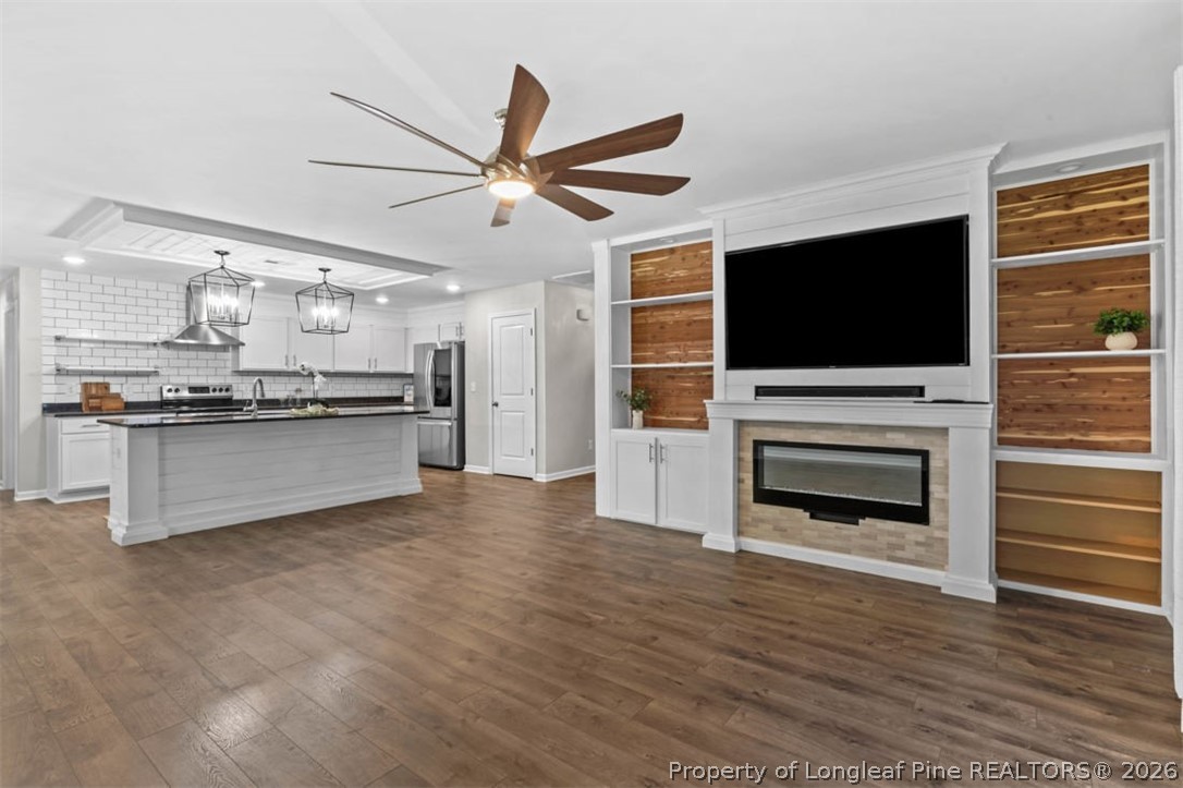 83 Kotata Avenue Bunnlevel, NC 28323 - Photo 21 of 49 a view of kitchen with kitchen island stainless steel appliances wooden floor and window