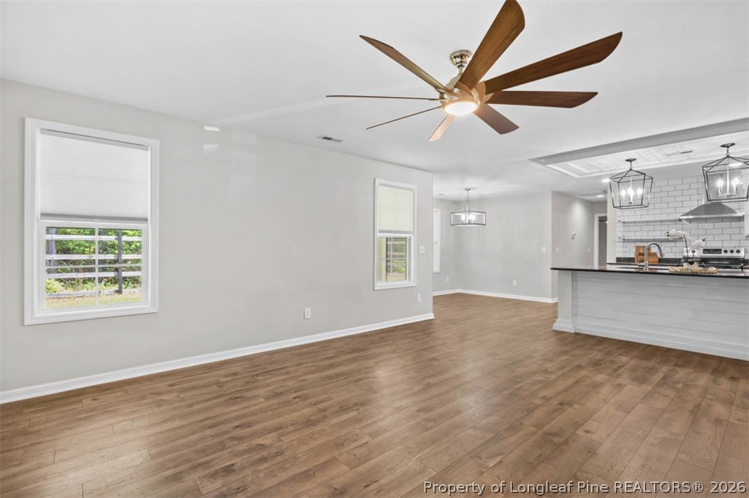 83 Kotata Avenue Bunnlevel, NC 28323 - Photo 22 of 49 a view of a kitchen with a sink and a ceiling fan