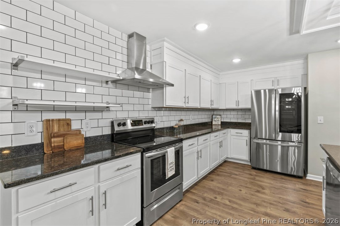 83 Kotata Avenue Bunnlevel, NC 28323 - Photo 27 of 49 a kitchen with stainless steel appliances granite countertop a sink and cabinets