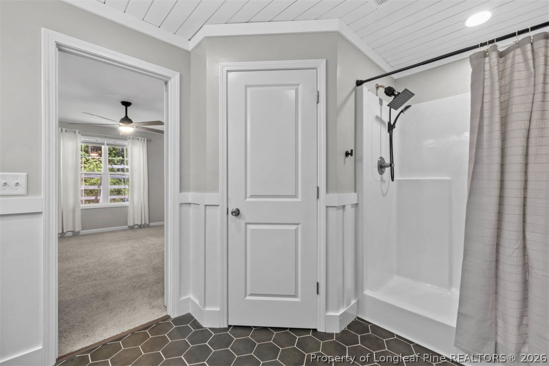 83 Kotata Avenue Bunnlevel, NC 28323 - Photo 40 of 49 a bathroom with a glass shower door