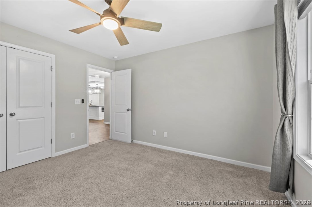 83 Kotata Avenue Bunnlevel, NC 28323 - Photo 43 of 49 a view of empty room with a ceiling fan and a window