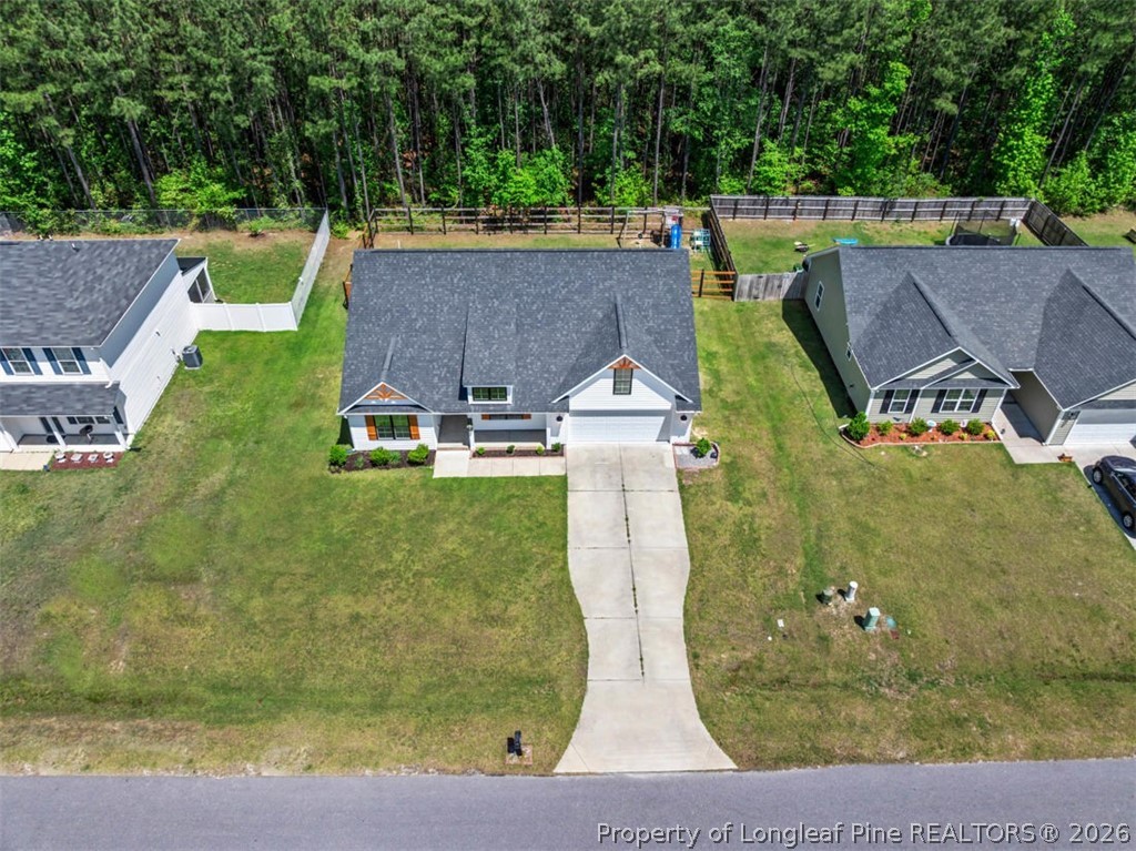 83 Kotata Avenue Bunnlevel, NC 28323 - Photo 5 of 49 an aerial view of a house with swimming pool and a yard