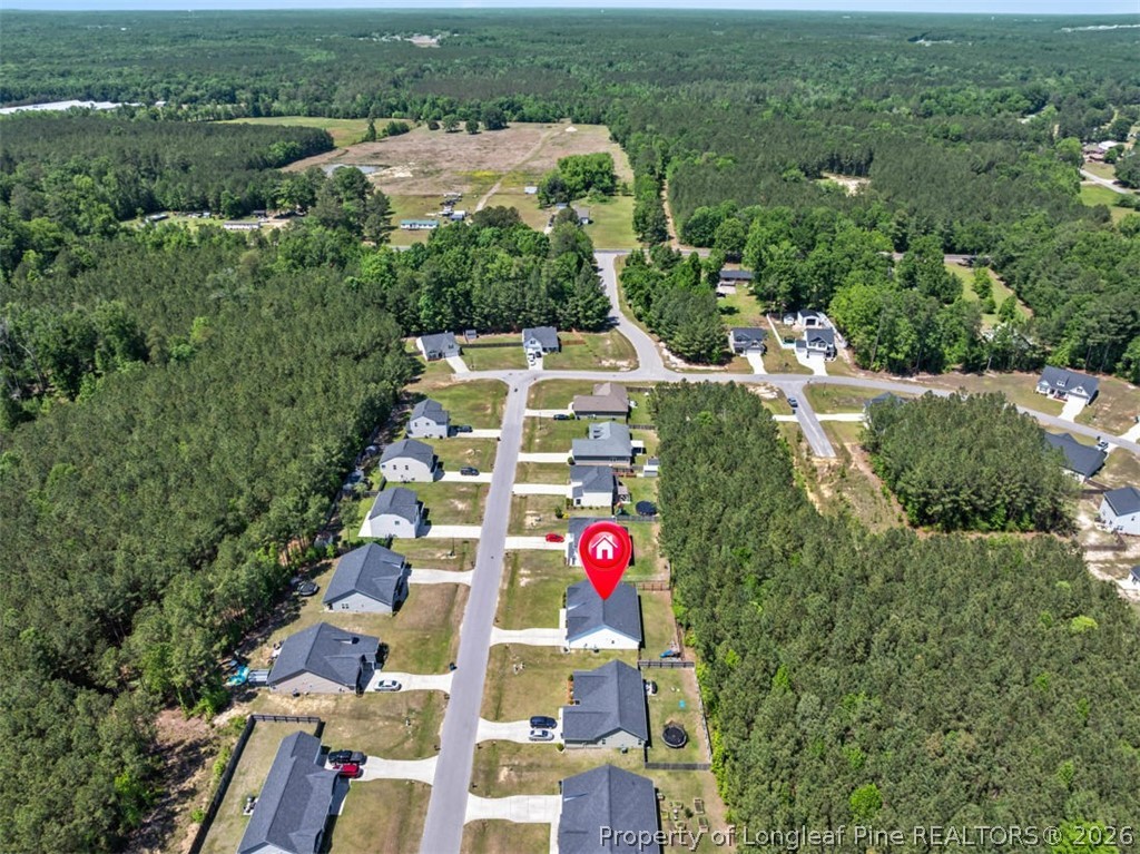 83 Kotata Avenue Bunnlevel, NC 28323 - Photo 7 of 49 an aerial view of residential houses with outdoor space and trees