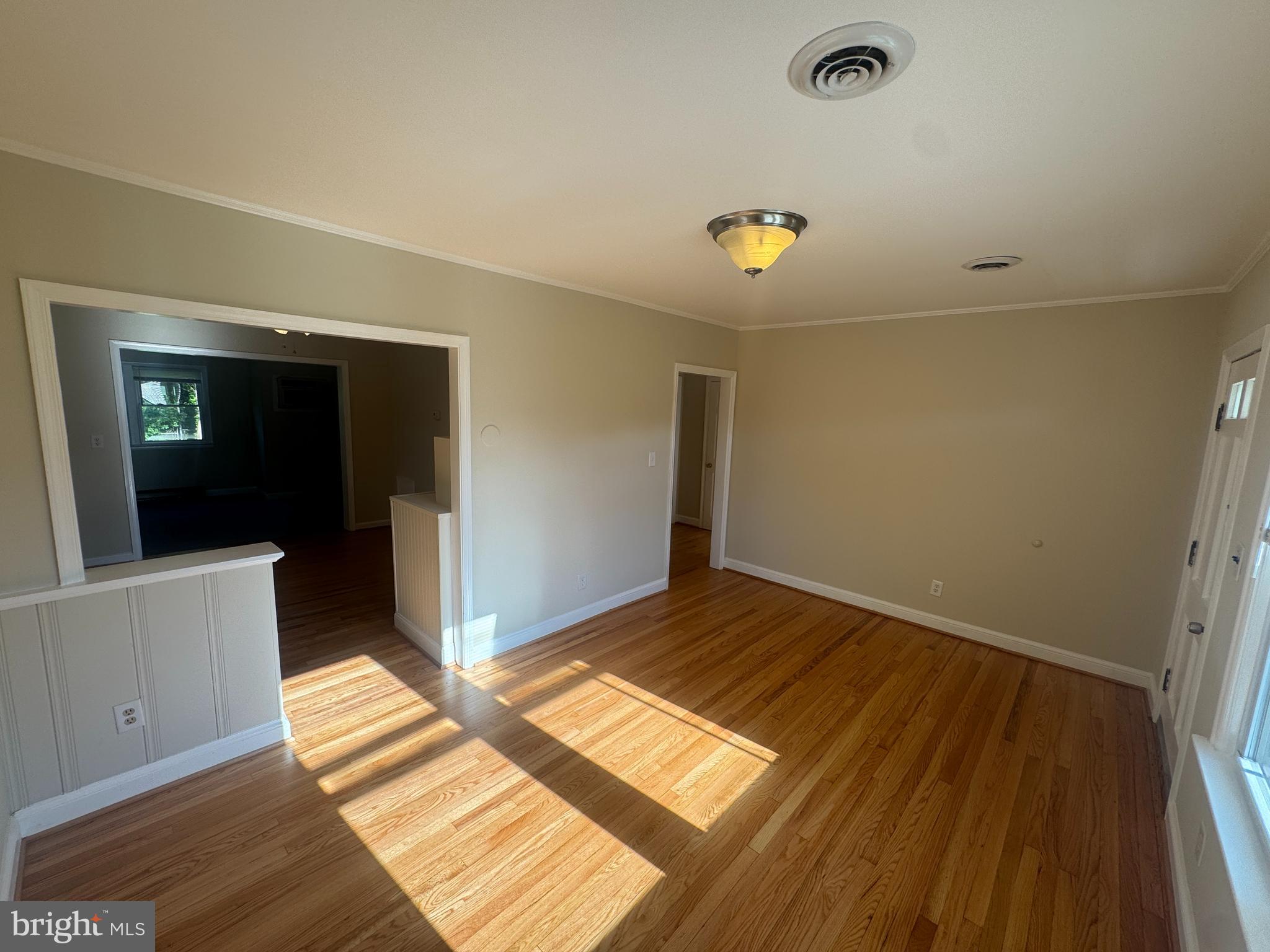 2810 Xavier Lane District Heights, MD 20747 - Photo 11 of 27 wooden floor in an empty room with a window