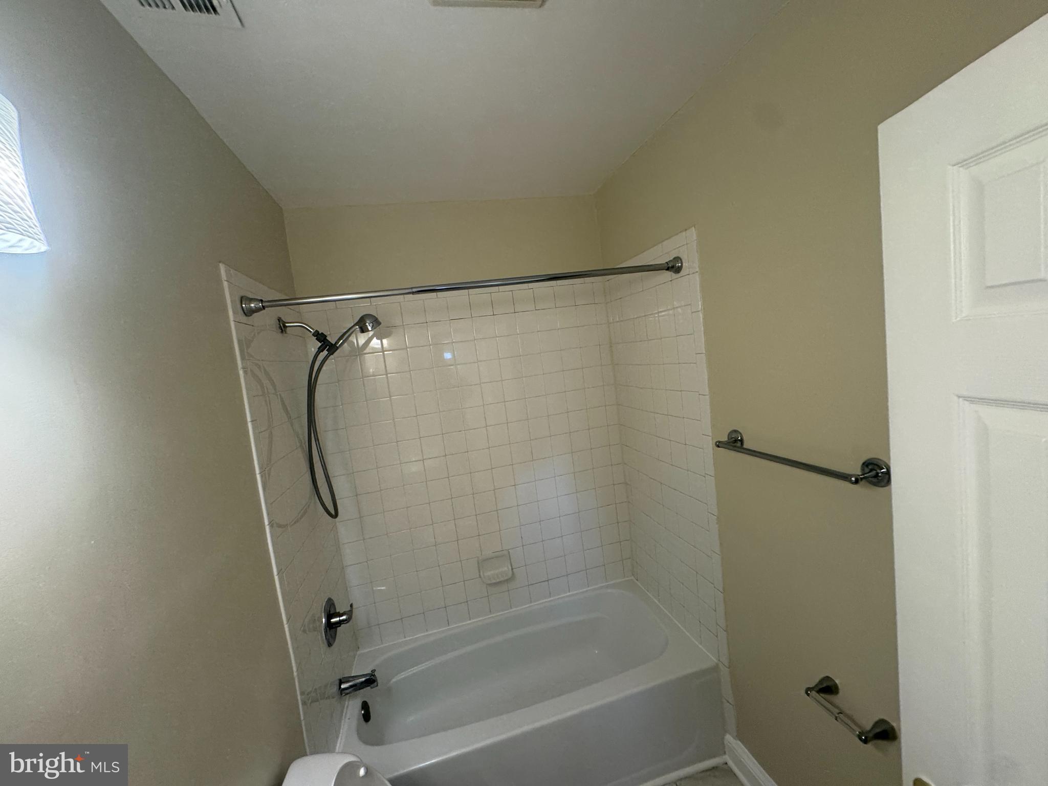 2810 Xavier Lane District Heights, MD 20747 - Photo 14 of 27 a bathroom with a shower and a bath tub