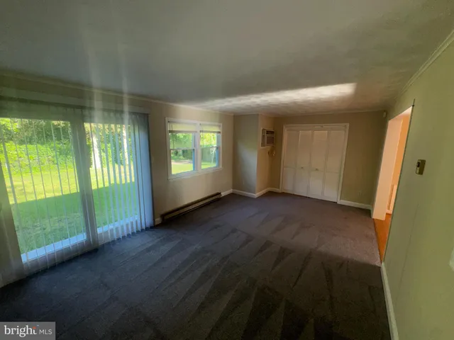 a view of livingroom with furniture and floor to ceiling window