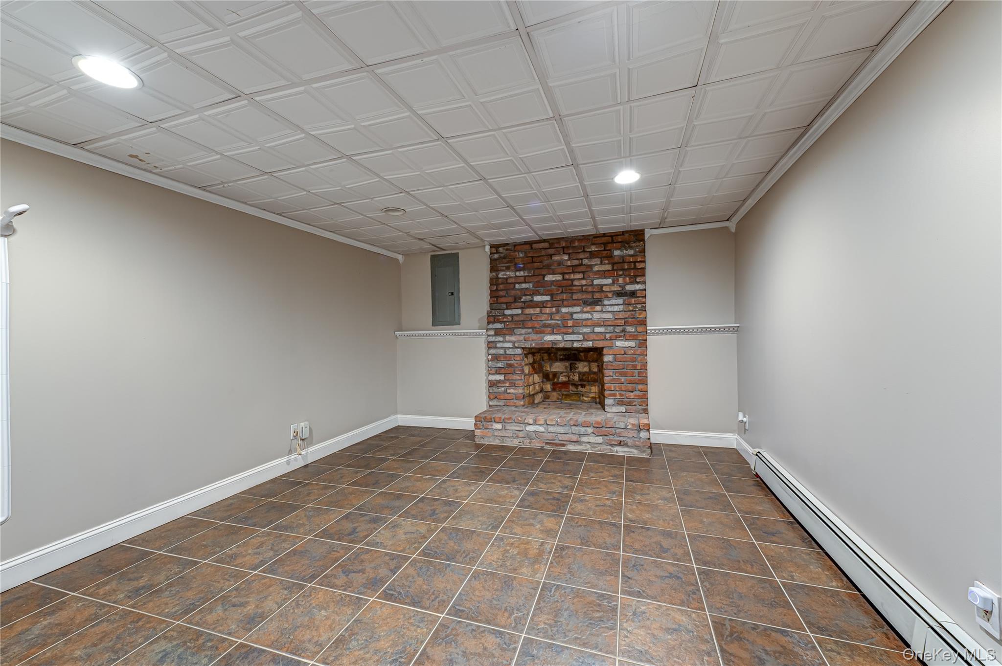 3 Thompson Hill Road St. James, NY 11780 - Photo 24 of 34 a view of an empty room with a fireplace