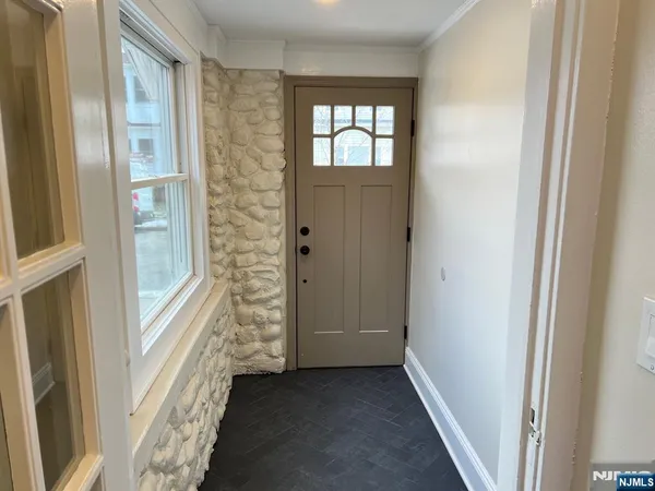 a view of entryway with a front door