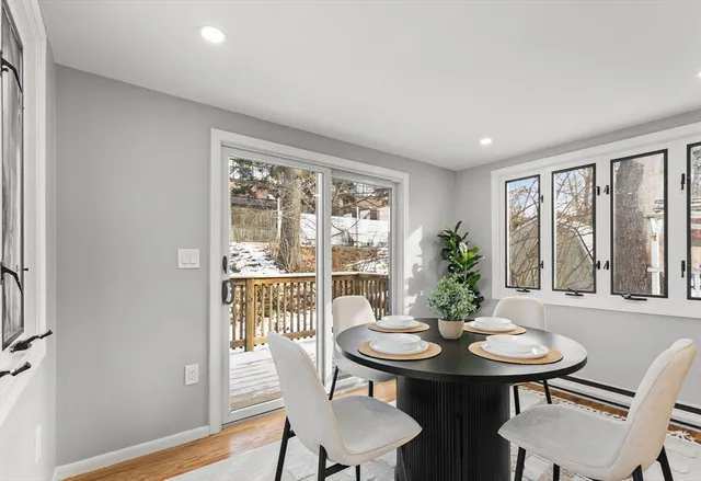 a view of a room with furniture window and wooden floor