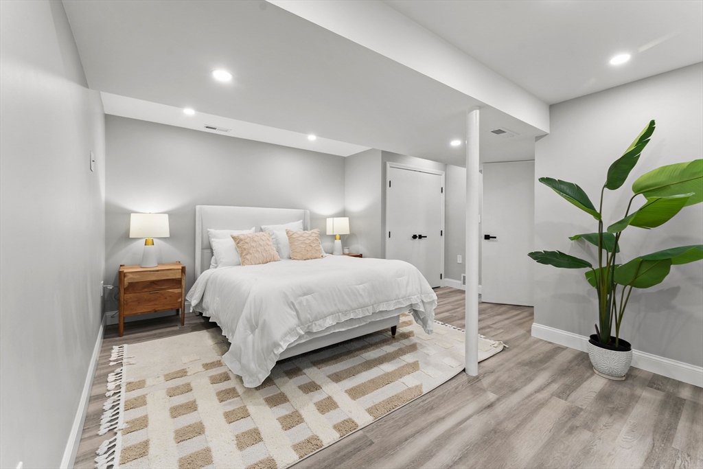 10 Van Brunt Street Boston, MA 02136 - Photo 19 of 31 a bedroom with a bed and a potted plant