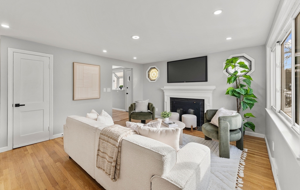 10 Van Brunt Street Boston, MA 02136 - Photo 3 of 31 a living room with furniture a fireplace and a flat screen tv