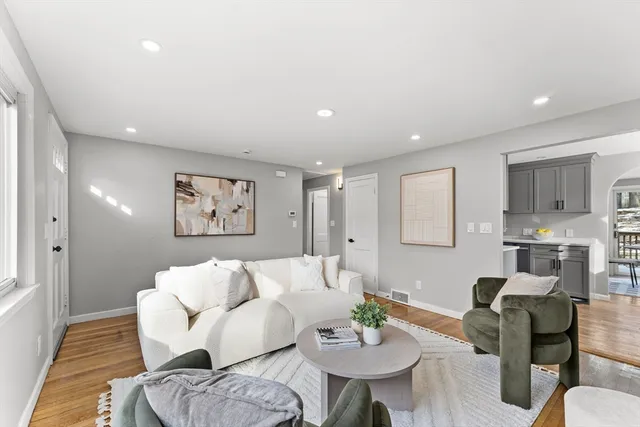 a living room with furniture and a table